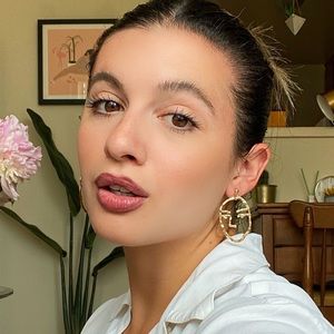 GOLD FACE STATEMENT EARRINGS